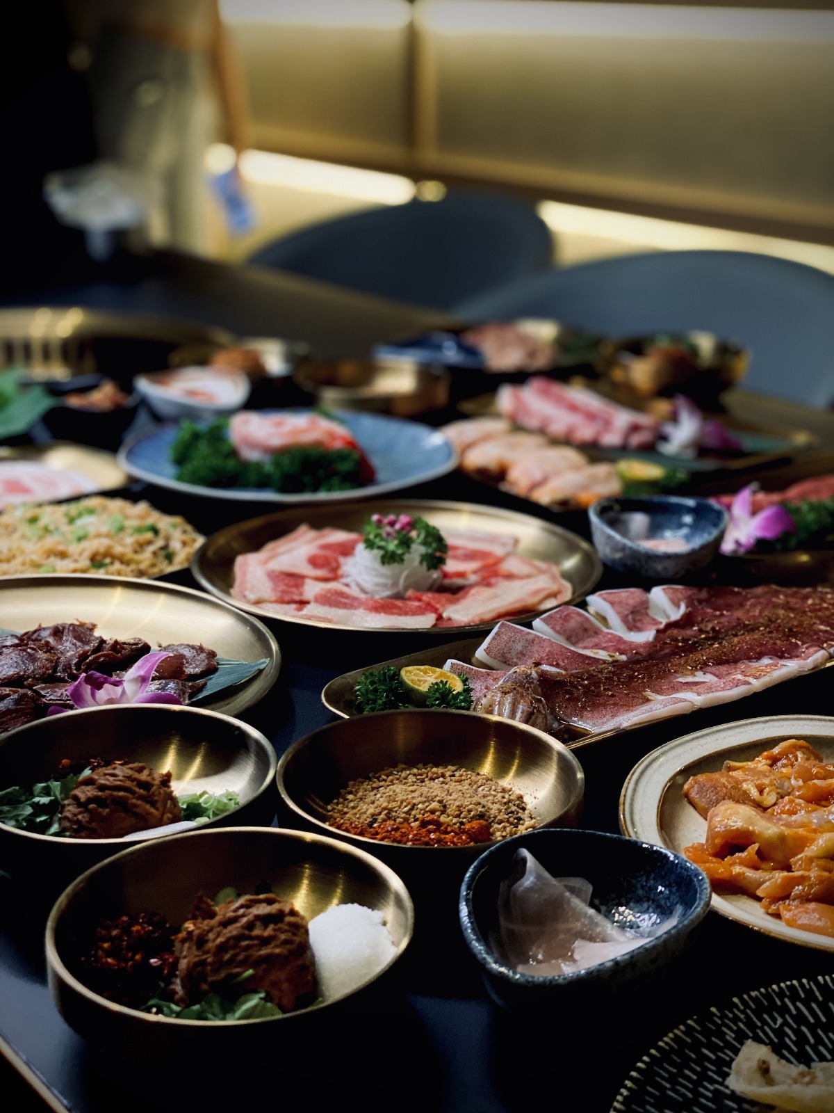 Friends sharing a charcoal BBQ feast at Qinghe